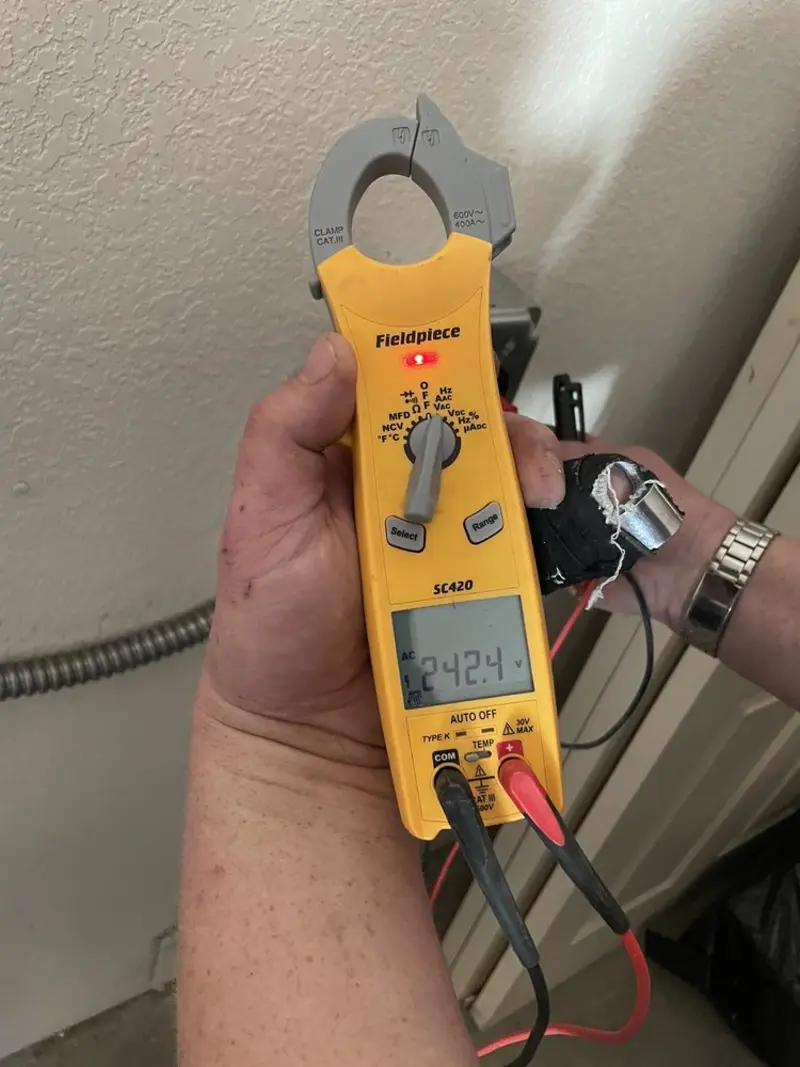 Voltage testing with clamp meter during Outlet Installation in Orleans